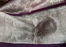 Old silk saree in cream with silver zari and a dark maroon border