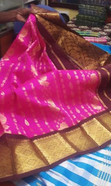 Old Kanjivaram silk saree in pink with a gold zari border