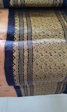 Zari-heavy old silk saree in navy with a gold hexagon weave